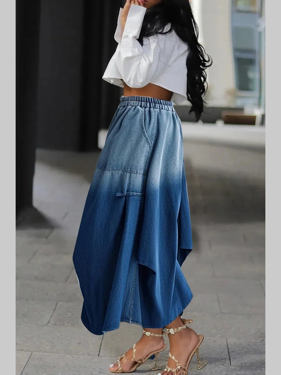 Side view of a women's relaxed-fit denim skirt with a blue gradient wash.