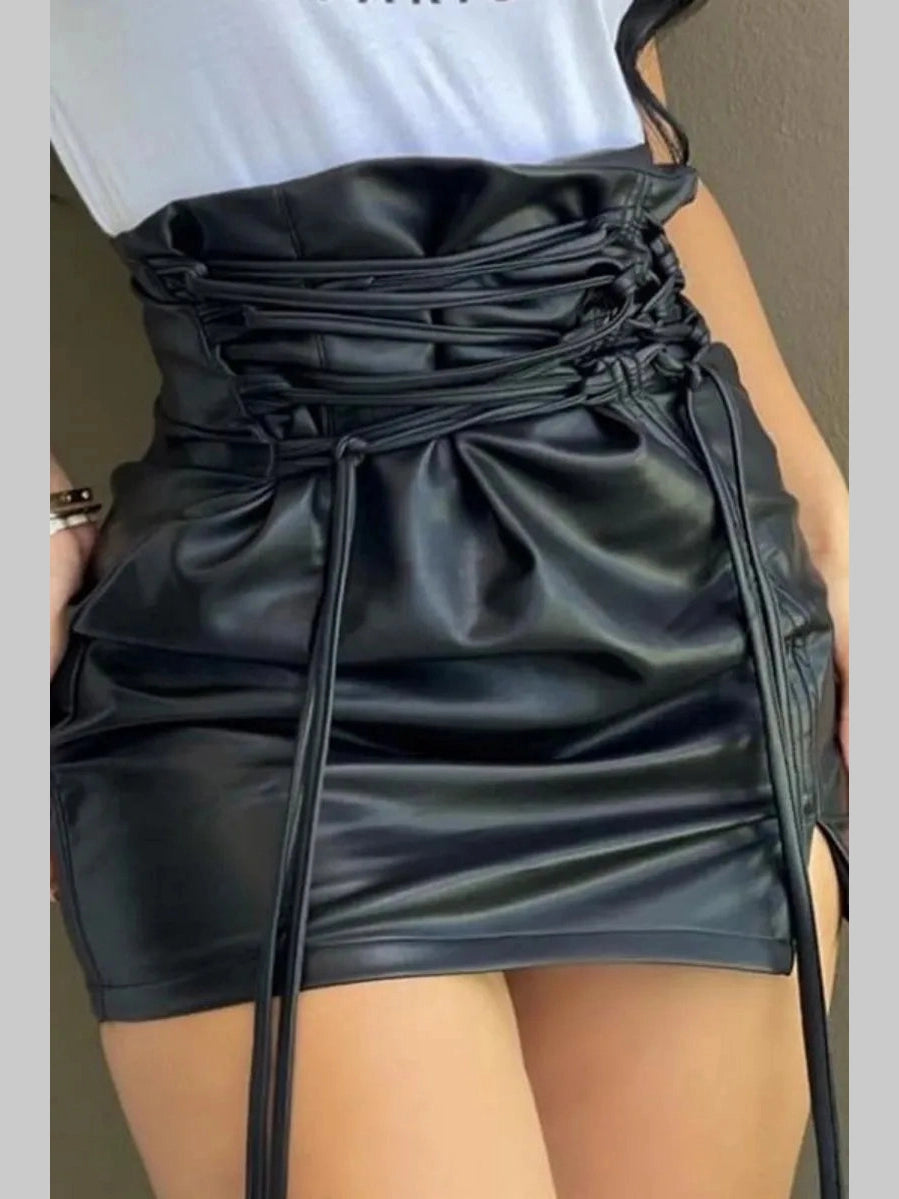 Women's black faux leather Fierce Rebel Corset Mini Skirt with high waist lace-up waistband.
