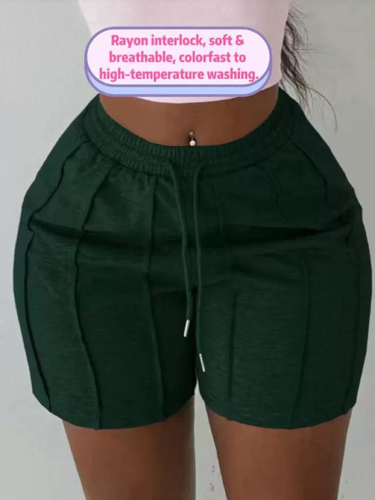 Women's green on the move pleated shorts with slim fit and textured pleated design.