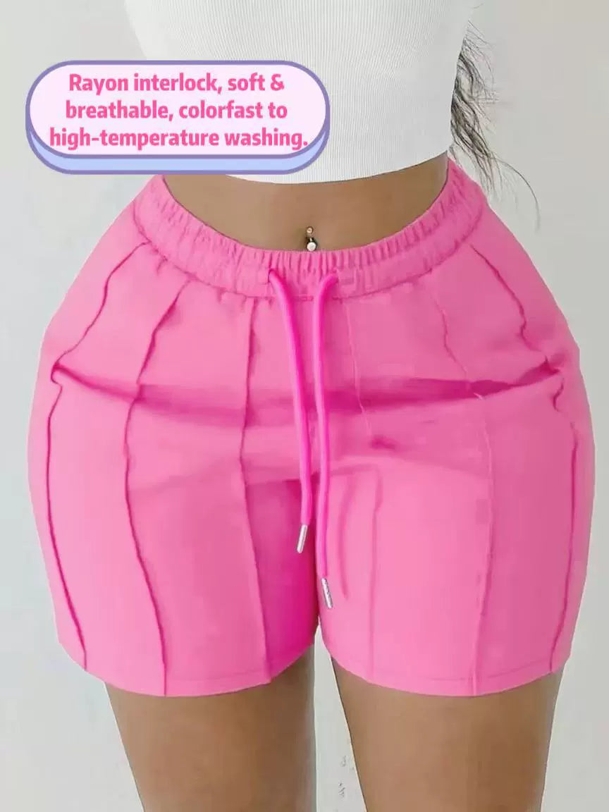 Women's pink on the move pleated shorts with slim fit and textured pleated design.