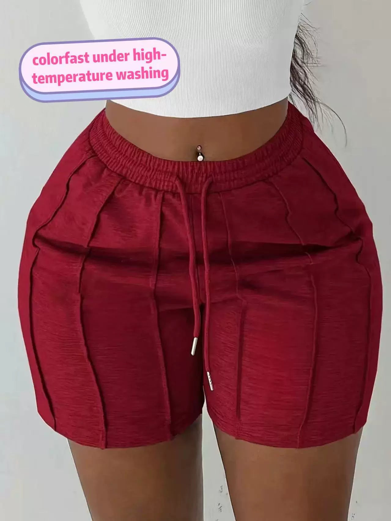 Women's wine red on the move pleated shorts with slim fit and textured pleated design.