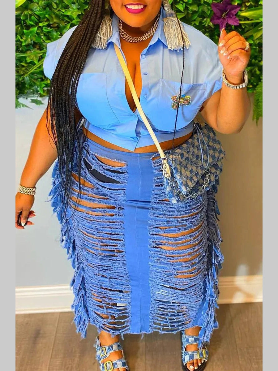 Front view of a high-waisted distressed denim maxi skirt with shredded fringe detailing.